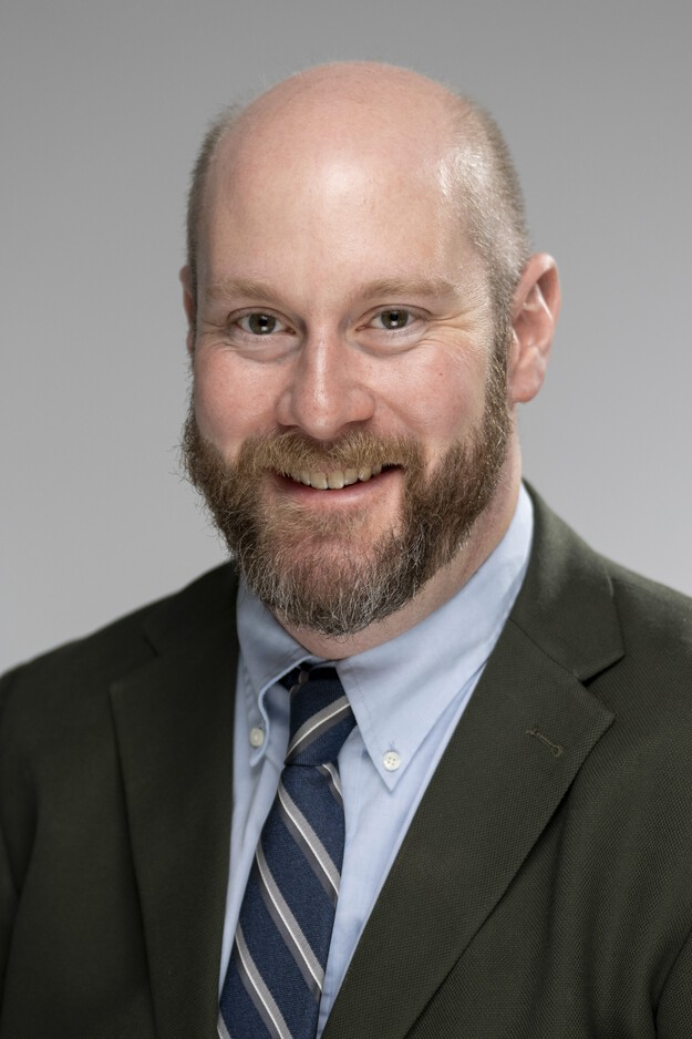 Image of Professor Rob Glover in suit and tie.