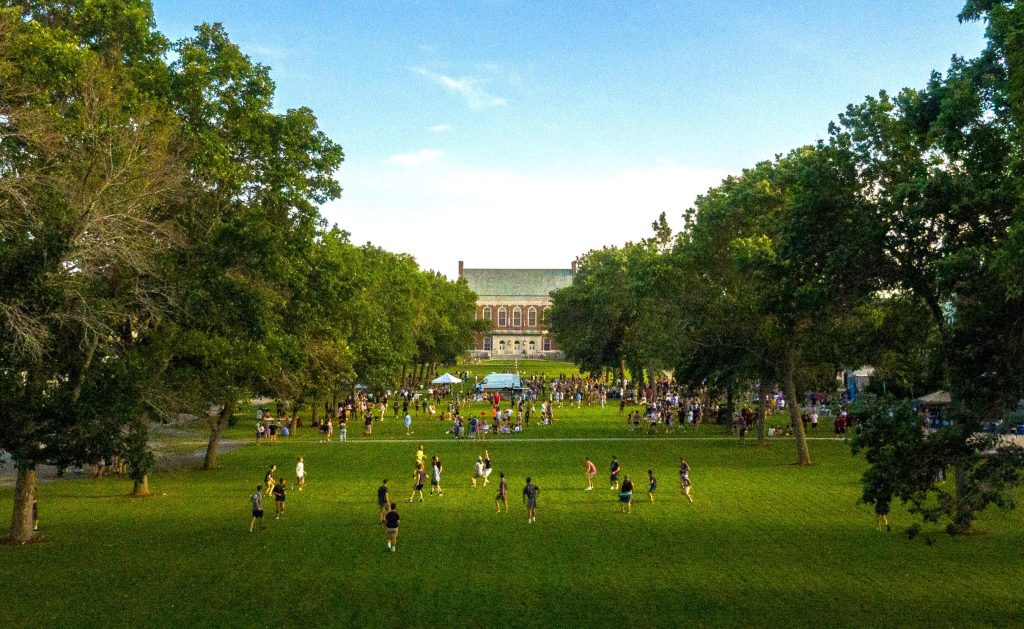 A photo of people on UMaine's Mall in late summer