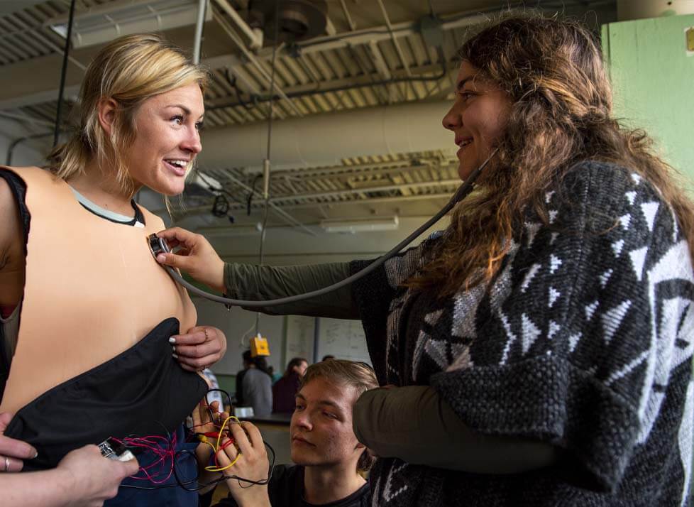 A photo of students working on their capstone project