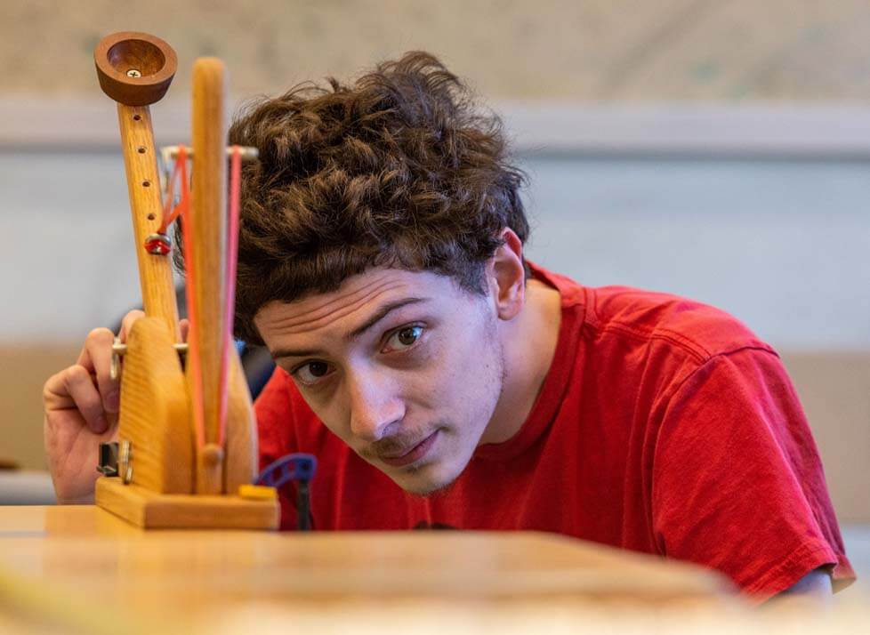 A photo of an engineering student in a lab class
