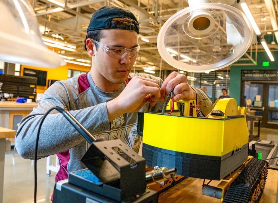 A photo of an engineering student working in a lab