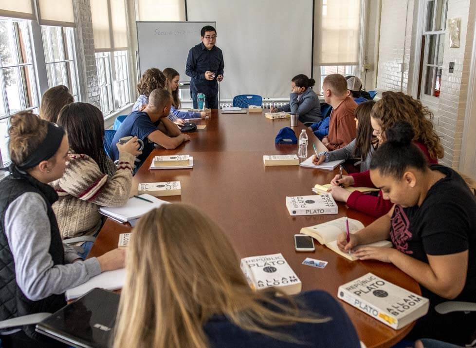 A class of students sitting around a table