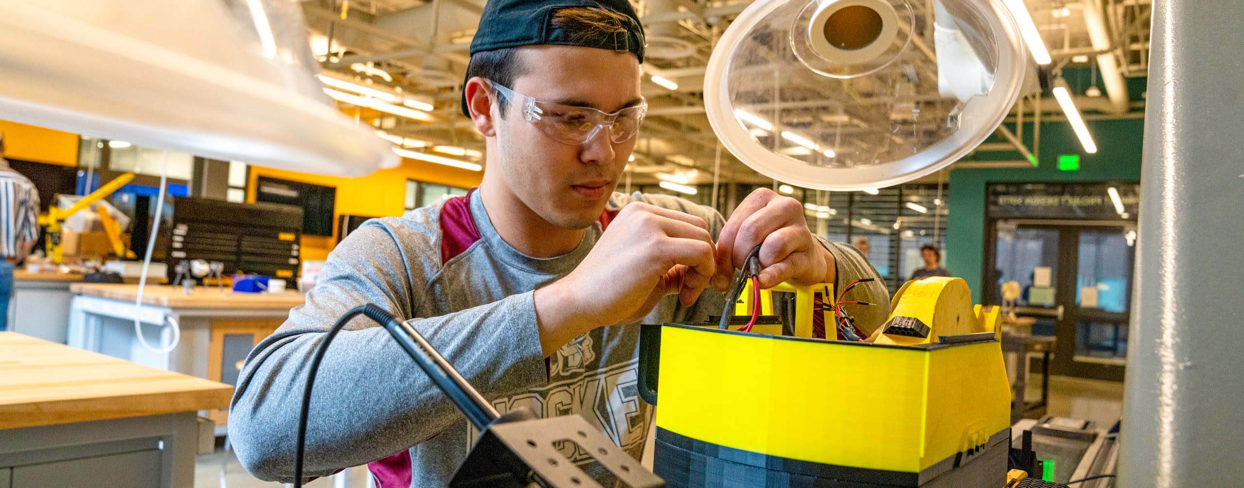 A photo of an engineering student working in a lab