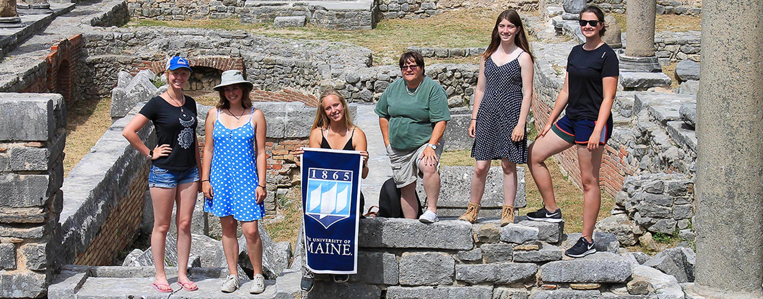 A photo of anthropology students at a historical site