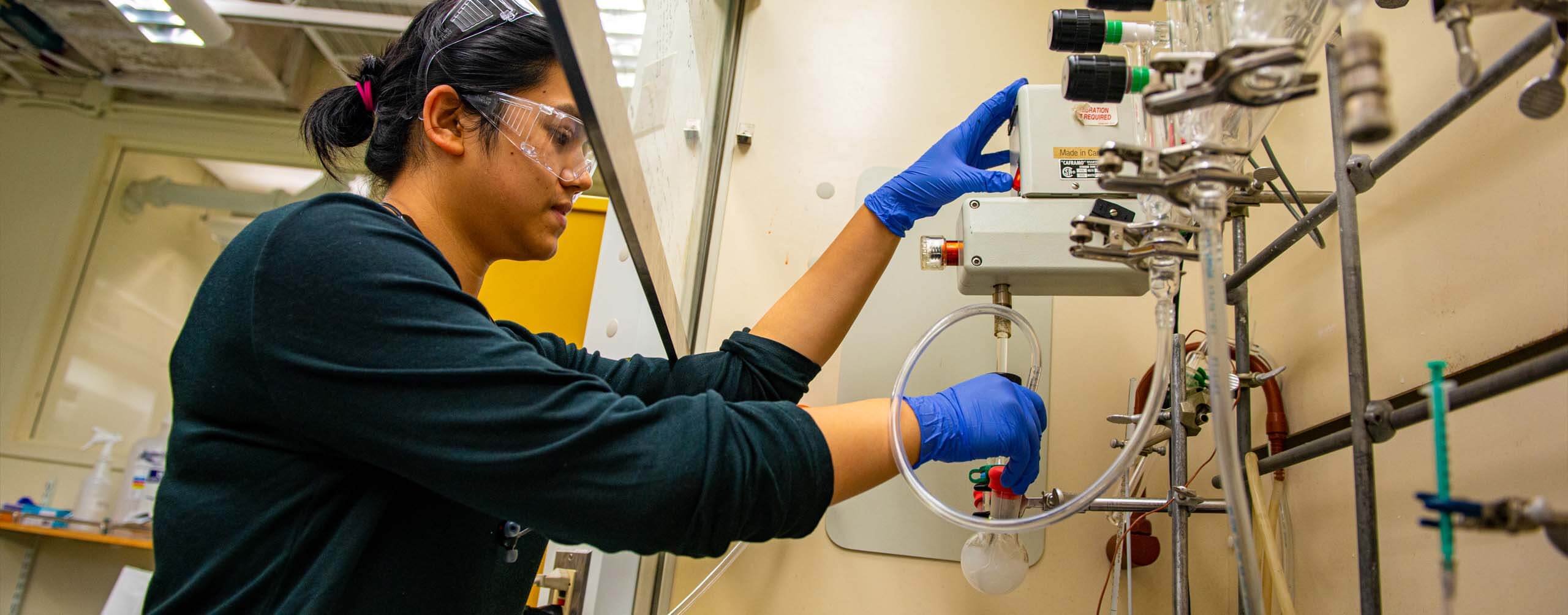 A photo of a person in a chemistry lab