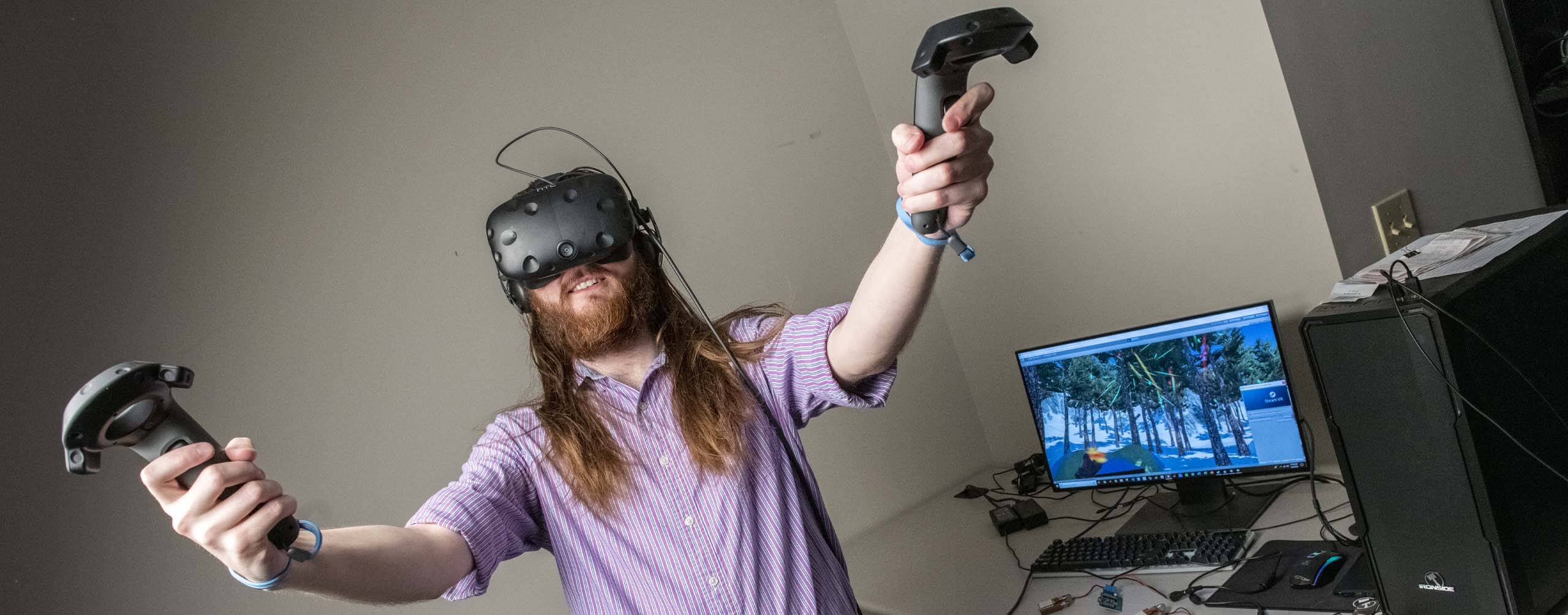 A photo of a person wearing a VR headset and holding controllers
