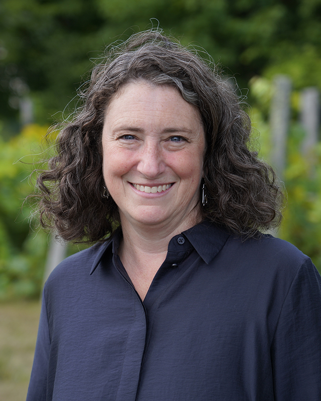 Portrait of Sabrina DeTurk smiling.