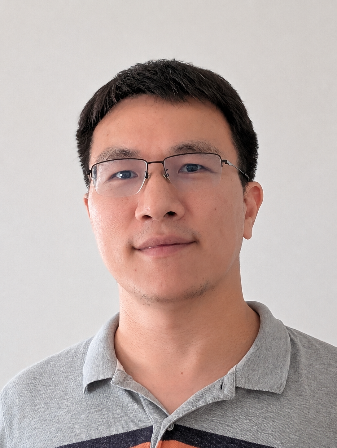 Zhipeng Liu smiling and wearing a polo