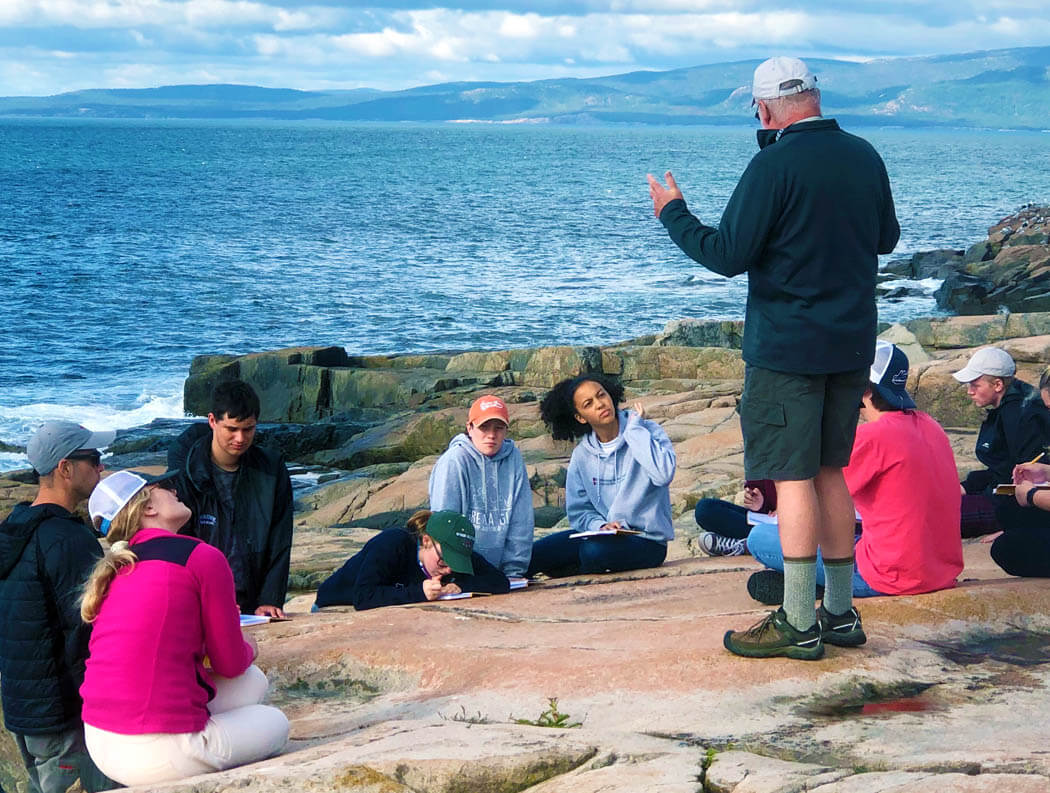 A professor teaches students on Maine's coast