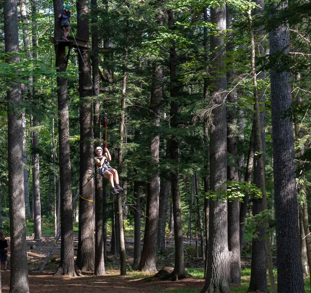 A photo of a student ziplining