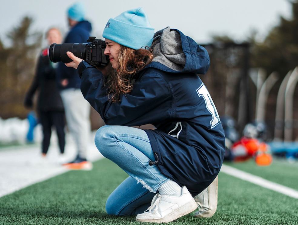 A photo of a student with a camera