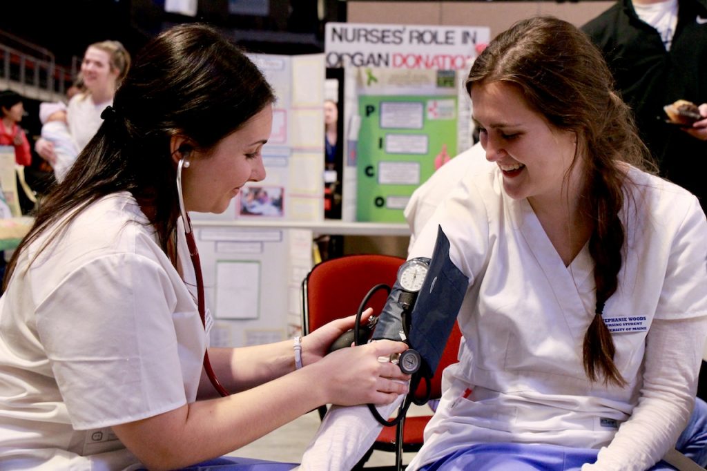 Image of student checking blood pressure