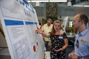 Emma Newcomb presenting a research poster