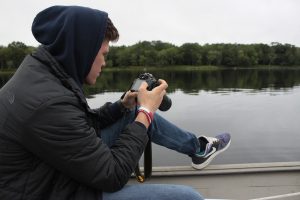 Nolan Altvater working on media documentation on the Penobscot River. Photo Credit: Tyler Quiring