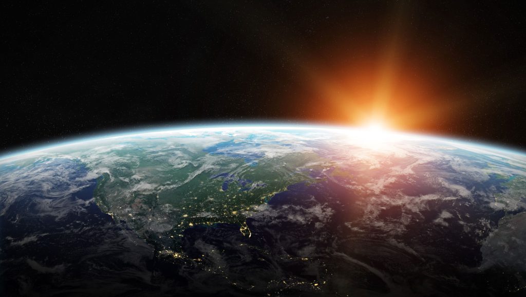 sunrise over the planet from space