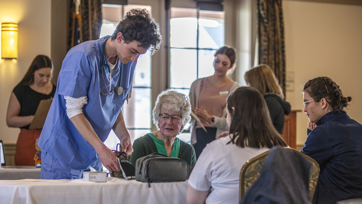 picture at an event for seniors showing nurses helping