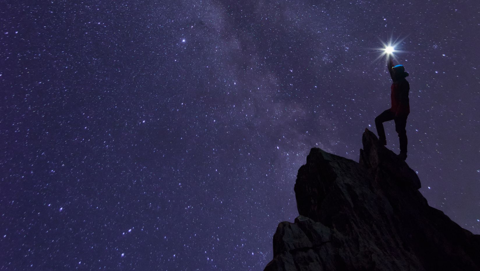 image of a person climbing mountain