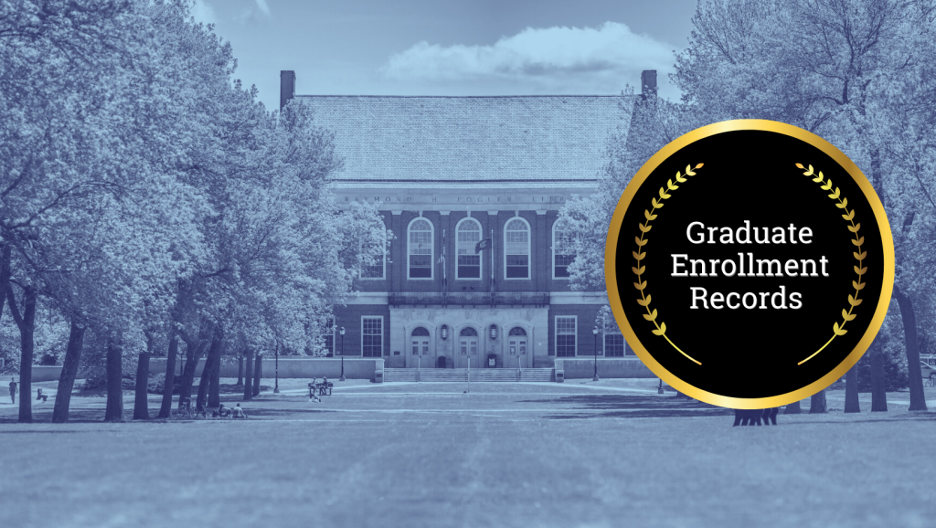 Image of UMaine building with graduate enrollment records crest