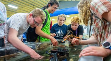 4-H students tour UMaine's Center for Cooperative Aquaculture Research facility where they are introduced to aquaculture techniques and research.