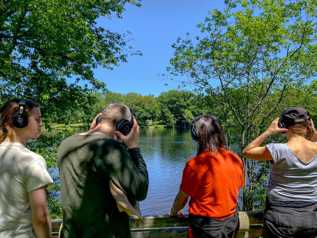 ISP members listen to audio by water