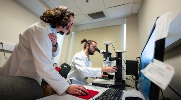Two GSBSE students work together in a lab