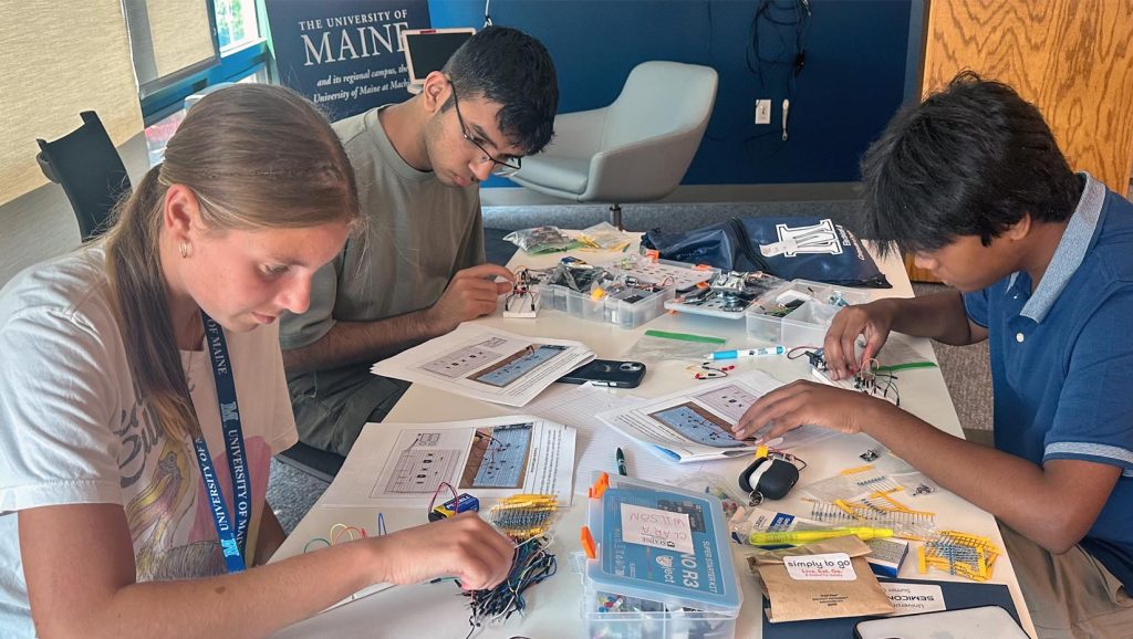 An image of students working on semiconductor chip design