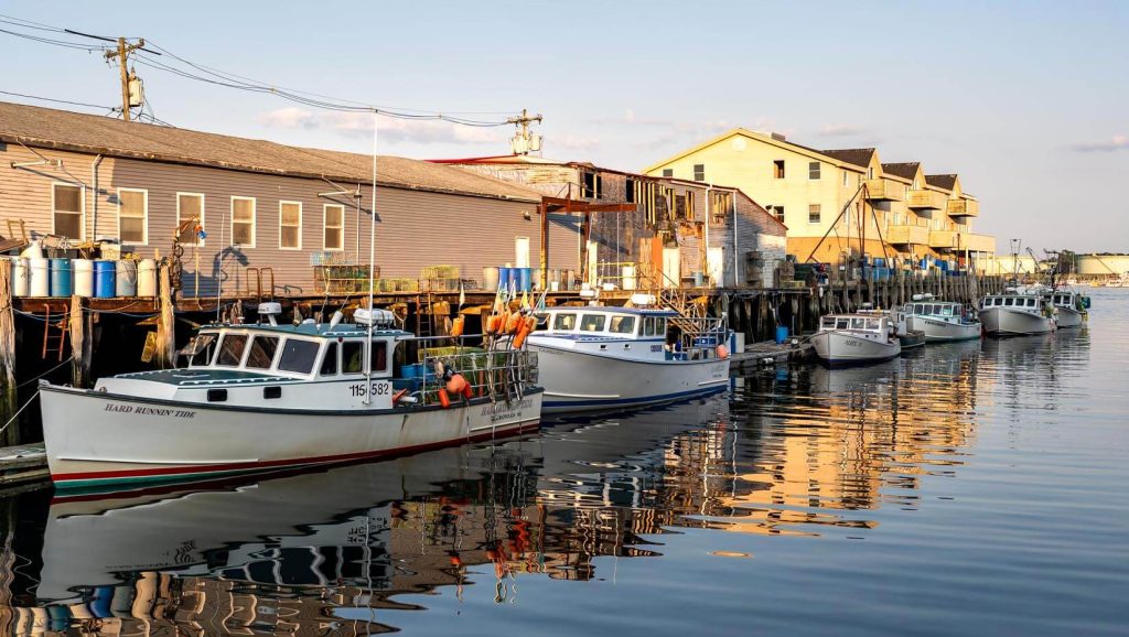 A photo of boats along a pier
