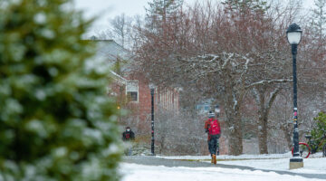 Students walk on paths around the campus mall in the winter