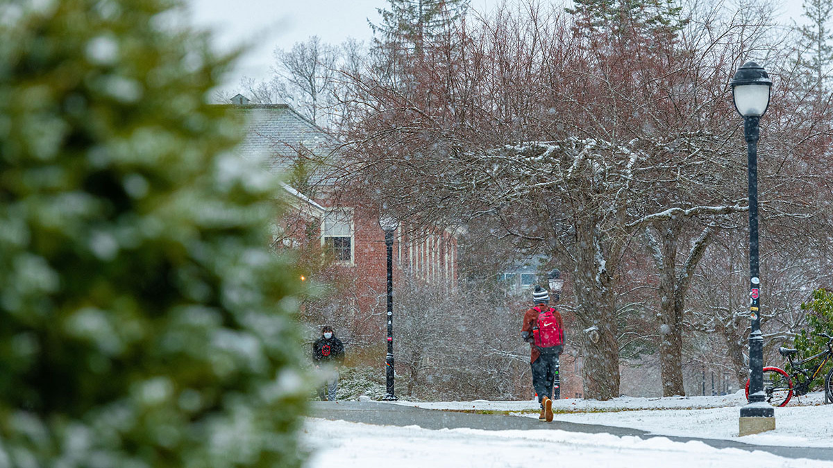 Students walk on paths around the campus mall in the winter
