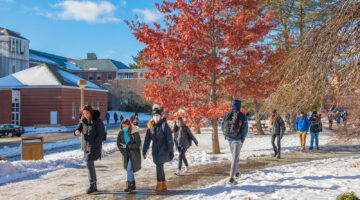 Students walk outside during class change during the first day of classes in January 2022.