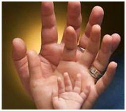 Photo of father's, mother's and child's hands, in color