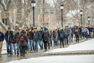 Photo of students walking to class in the snow