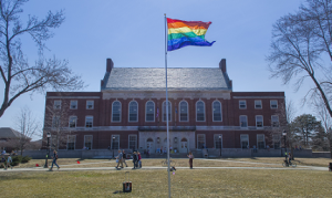 Photo of Rainbow flag in front of Fogler Library