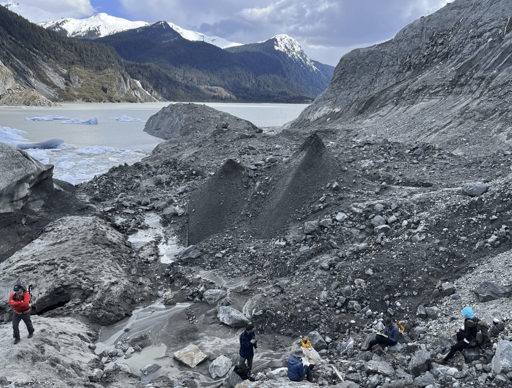 Students studying the rocks around Mendenhall Lake.