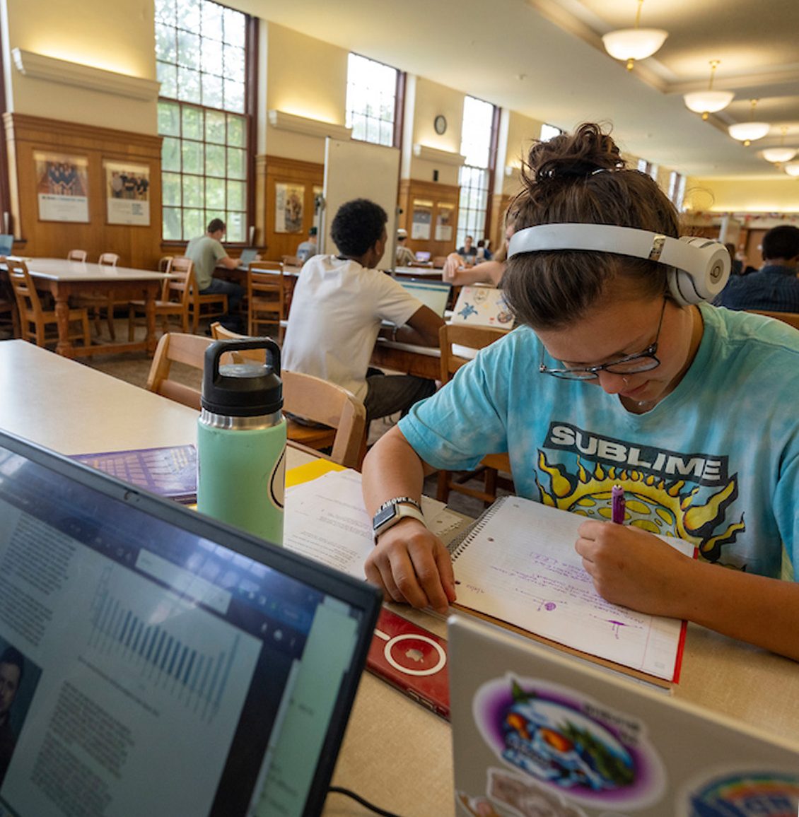 A polaroid of a student studying