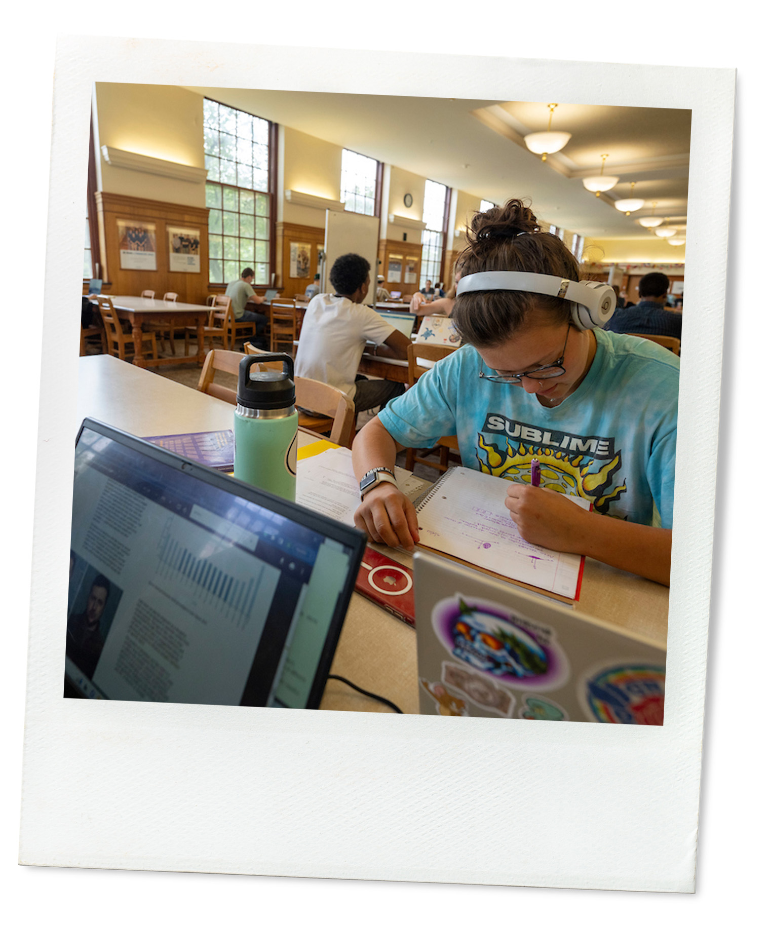 A polaroid of a student studying