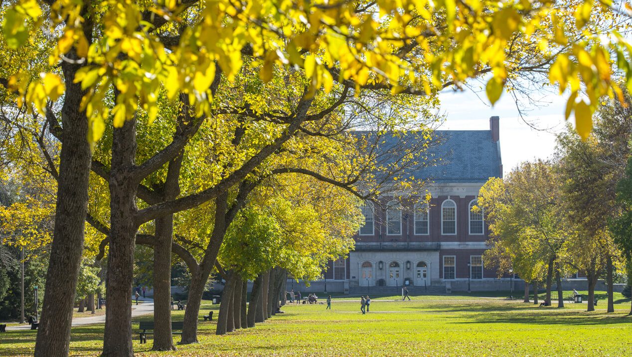 Fogler Library and trees with fall foliage