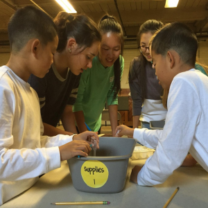 SMART interns teach elementary school kids about macroinvertebrates