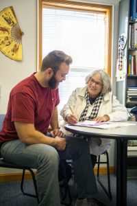 Male Student and Faculty Member in a one-on-one session