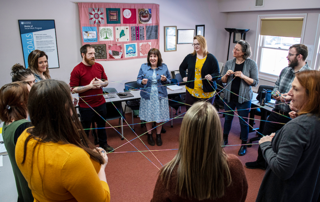 A photo of social work students in a circle