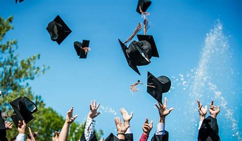 graduation caps in the sky