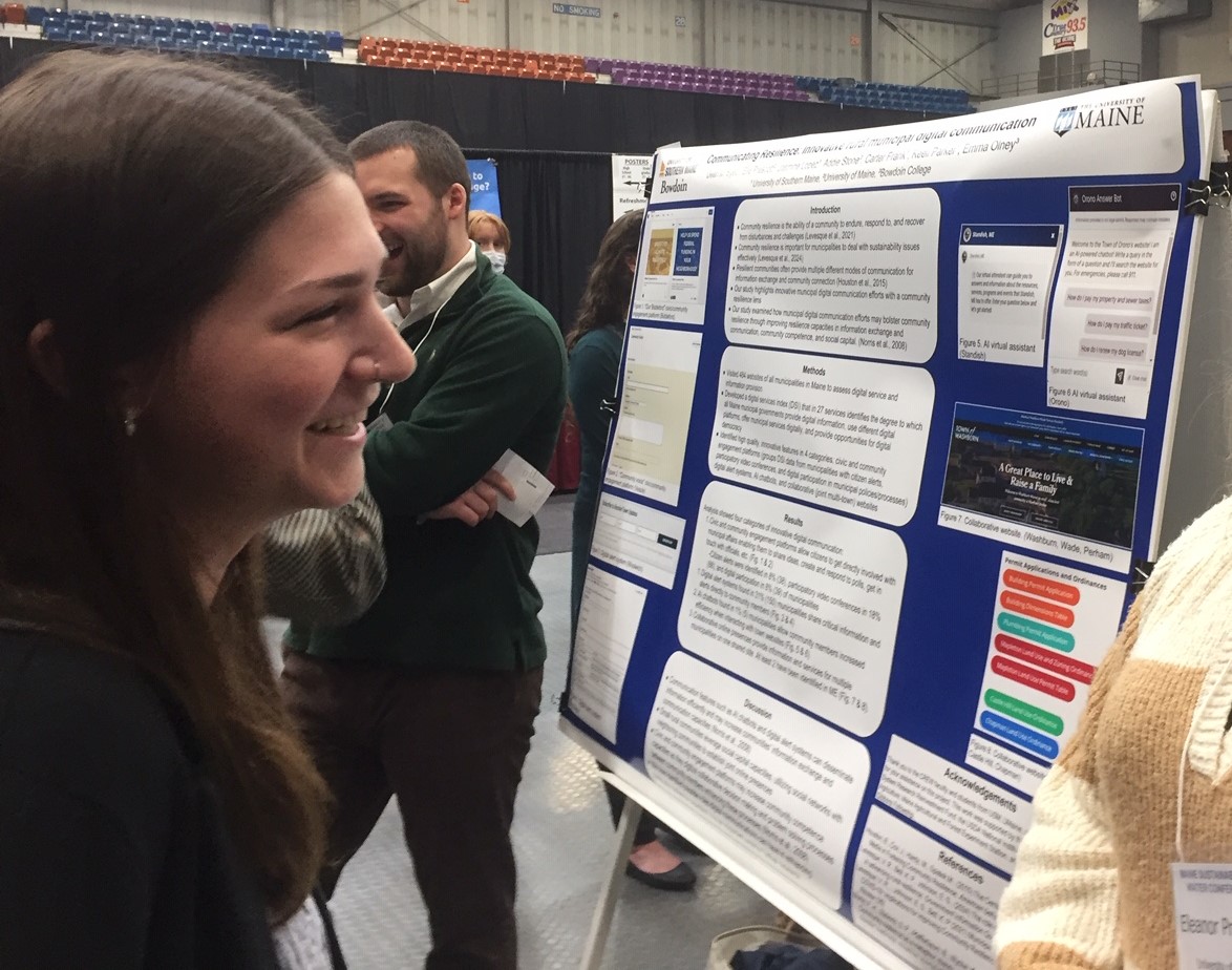 Photo of Student presenting poster at conference