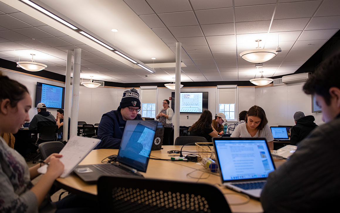 A photo of students working on their laptops