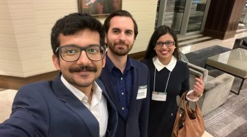 A selfie of three graduate students