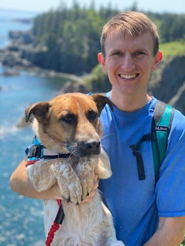 A photo of Travis Blackmer and his dog, Django