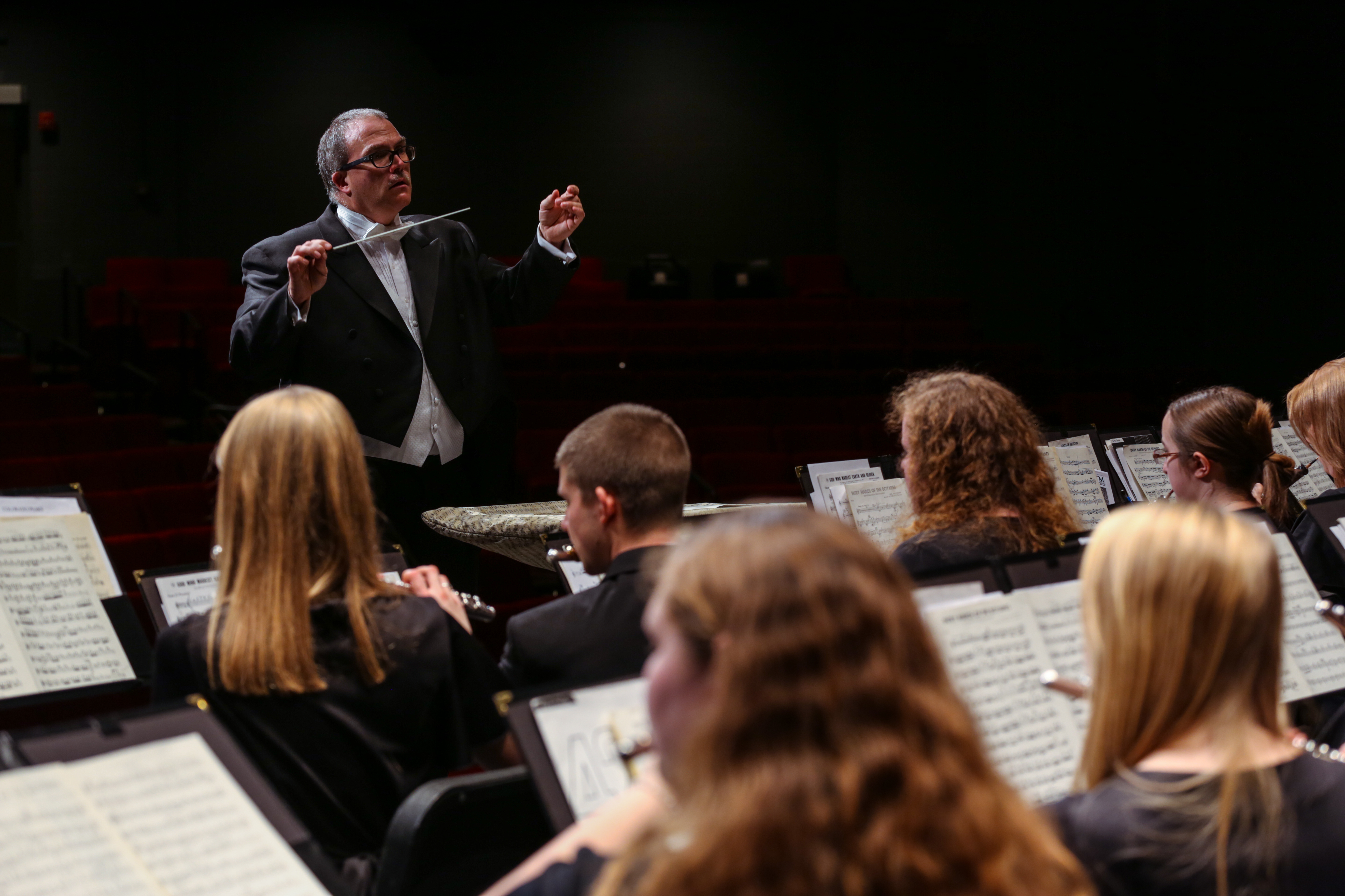 Chris White conducting students