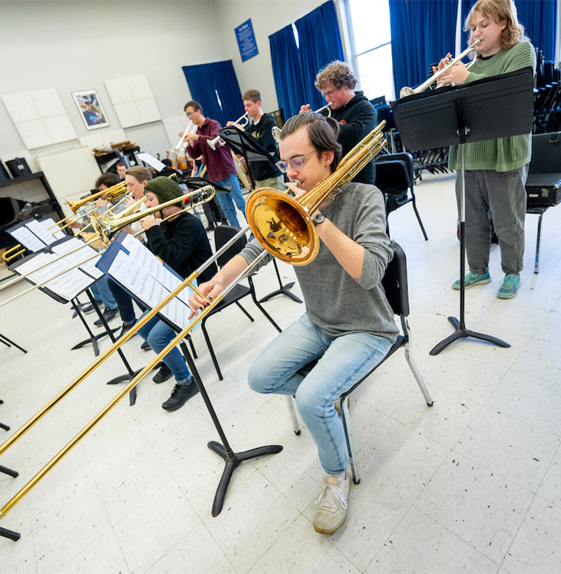 A photo of a trombone player in the instrument rehearsal hall