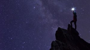 image of a person climbing mountain