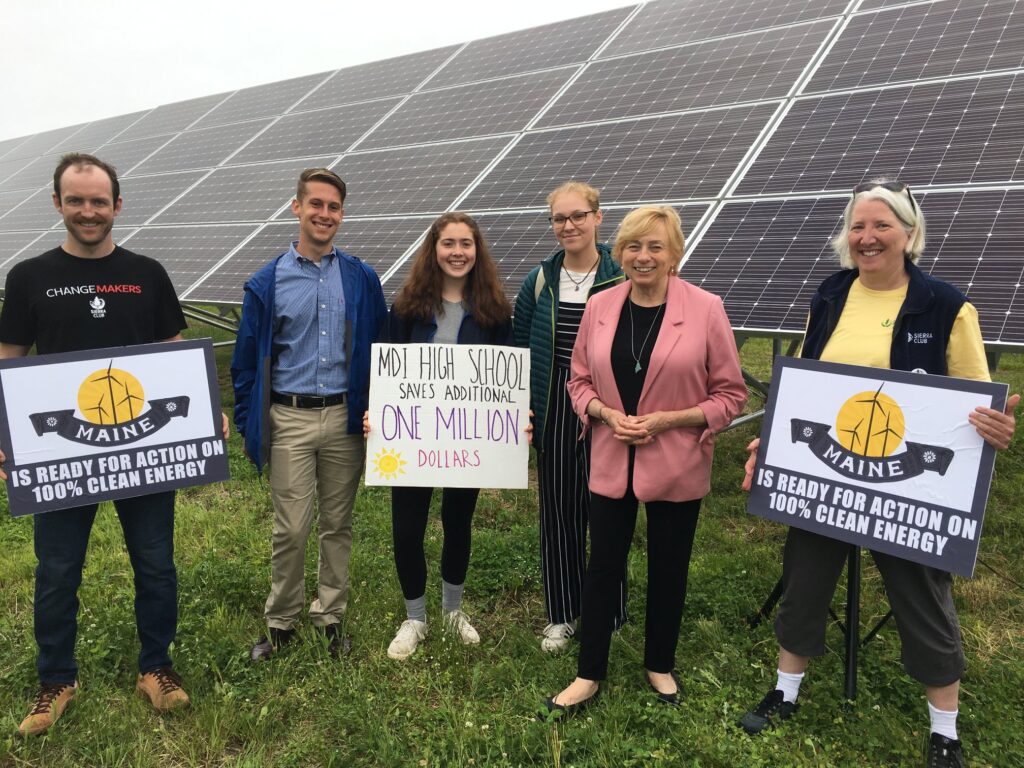 A group of people with Gov. Janet Mills