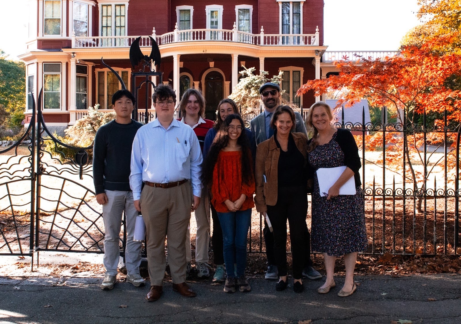 A group poses in front of Stephen King's Bangor home